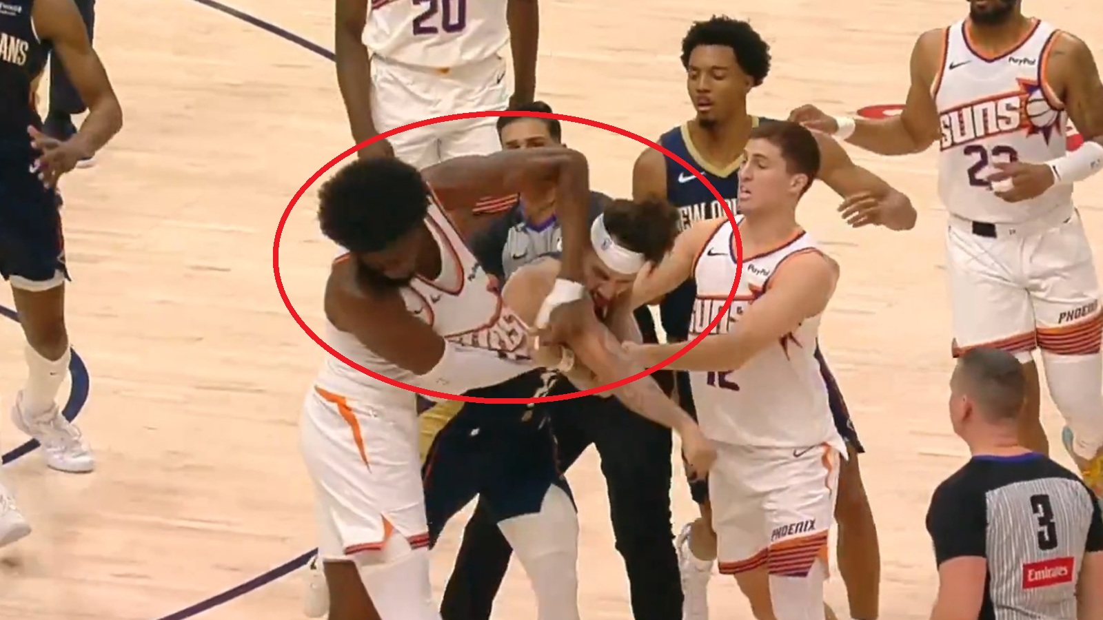 Jose Alvarado and Mark Williams throwing punches at each other