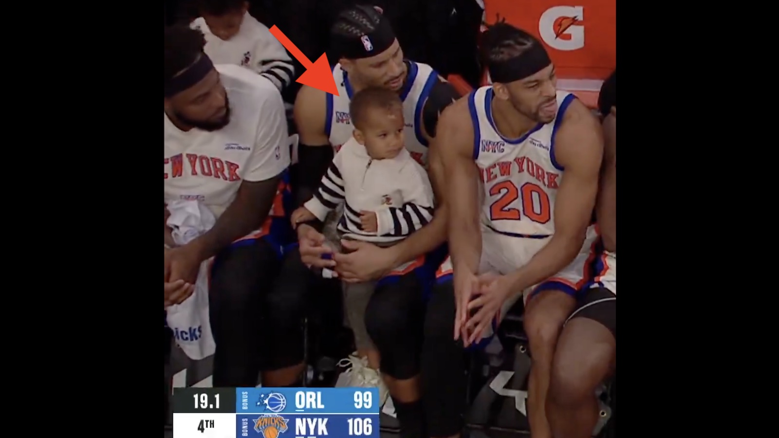 Knicks guard Josh Hart with his son on his lap