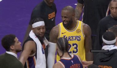 Lakers star LeBron James laughing with Suns players