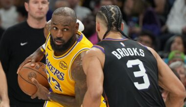 Los Angeles Lakers forward Lebron James squares up to Phoenix Suns forward Dillon Brooks (3) during the first half of an NBA basketball game, Tuesday, Dec. 23, 2025, in Phoenix. (AP Photo/Rick Scuteri)