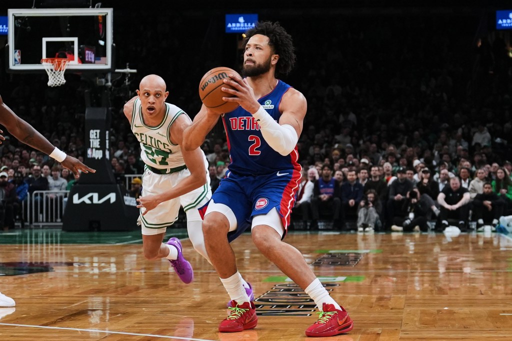 Detroit Pistons guard Cade Cunningham (2) lines up a 3-point shot against Boston Celtics guard Jordan Walsh (27).