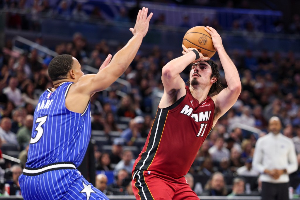 iami Heat forward Jaime Jaquez Jr. (11) shoots the ball over Orlando Magic guard Desmond Bane (3).