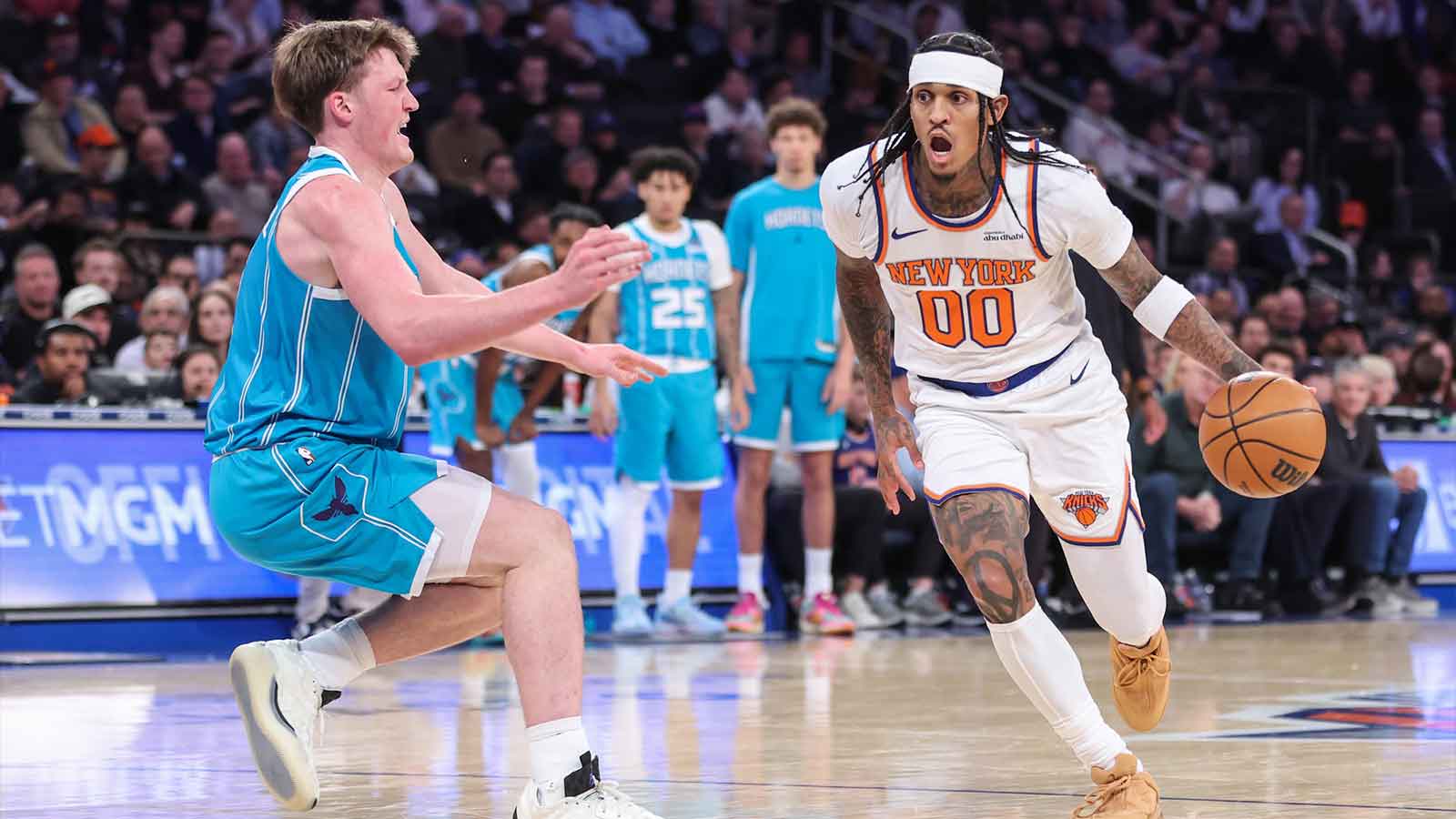 Dec 3, 2025; New York, New York, USA; New York Knicks guard Jordan Clarkson (00) drives past Charlotte Hornets guard Kon Knueppel (7) in the third quarter at Madison Square Garden. Mandatory Credit: Wendell Cruz-Imagn Images
