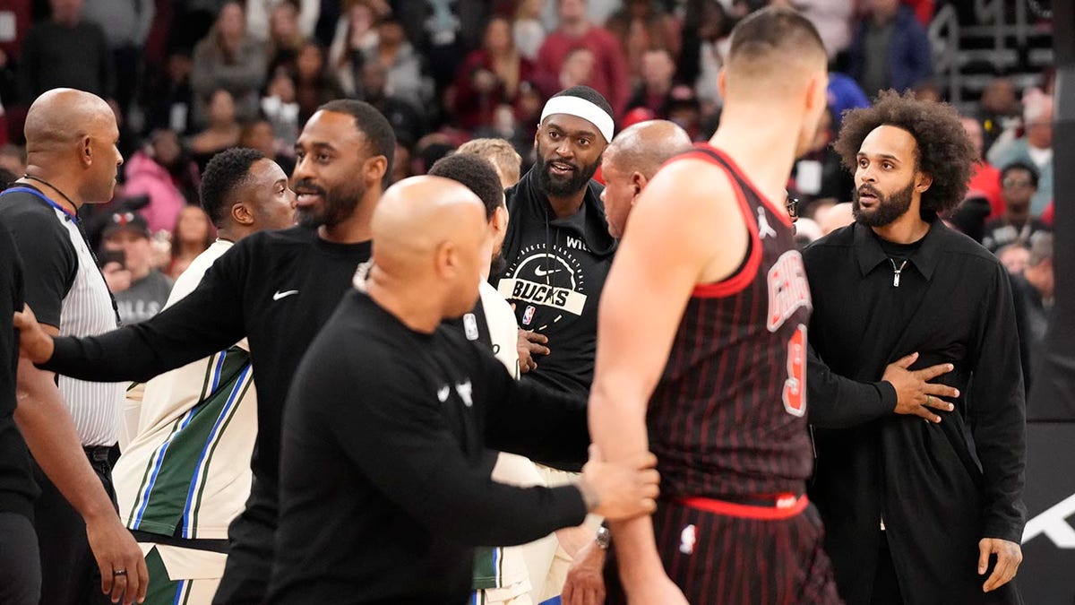 Bulls and Bucks players get into scrum