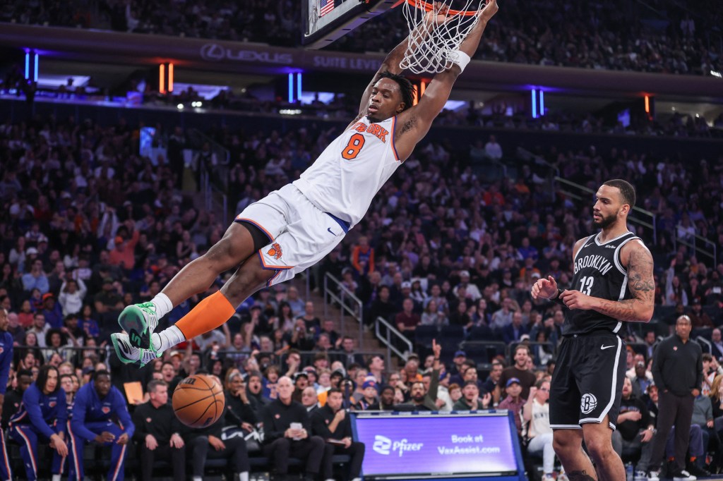 New York Knicks forward OG Anunoby (8) dunks over Brooklyn Nets guard Tyrese Martin (13).