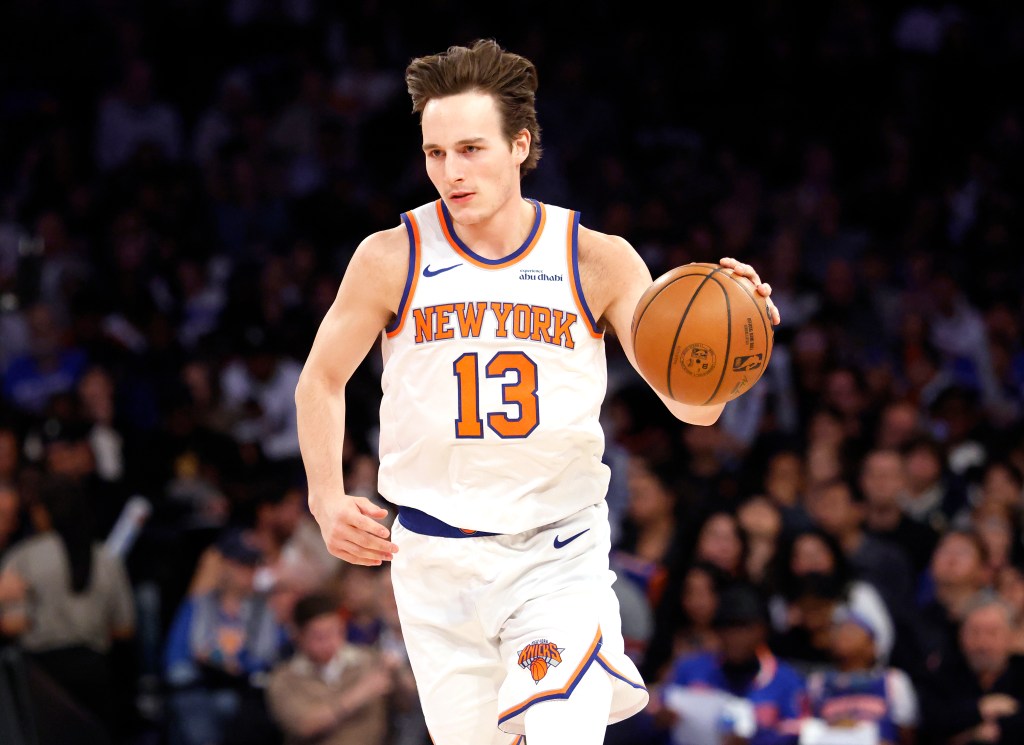 New York Knicks guard Tyler Kolek drives down the court, dribbling a basketball.