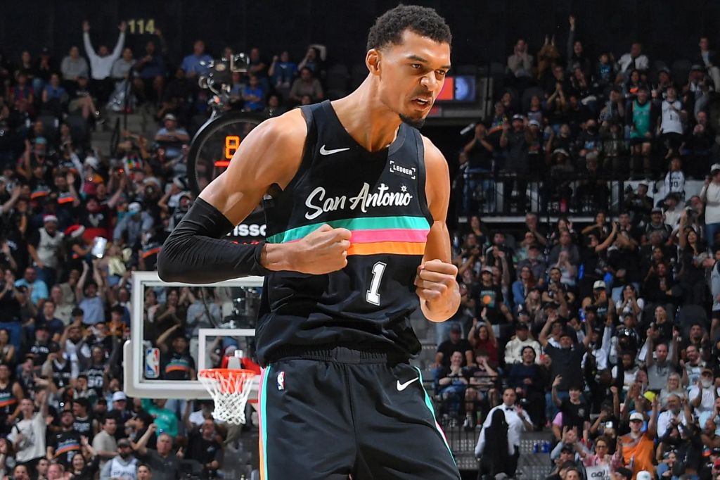 An image collage containing 1 images, Image 1 shows Victor Wembanyama #1 of the San Antonio Spurs