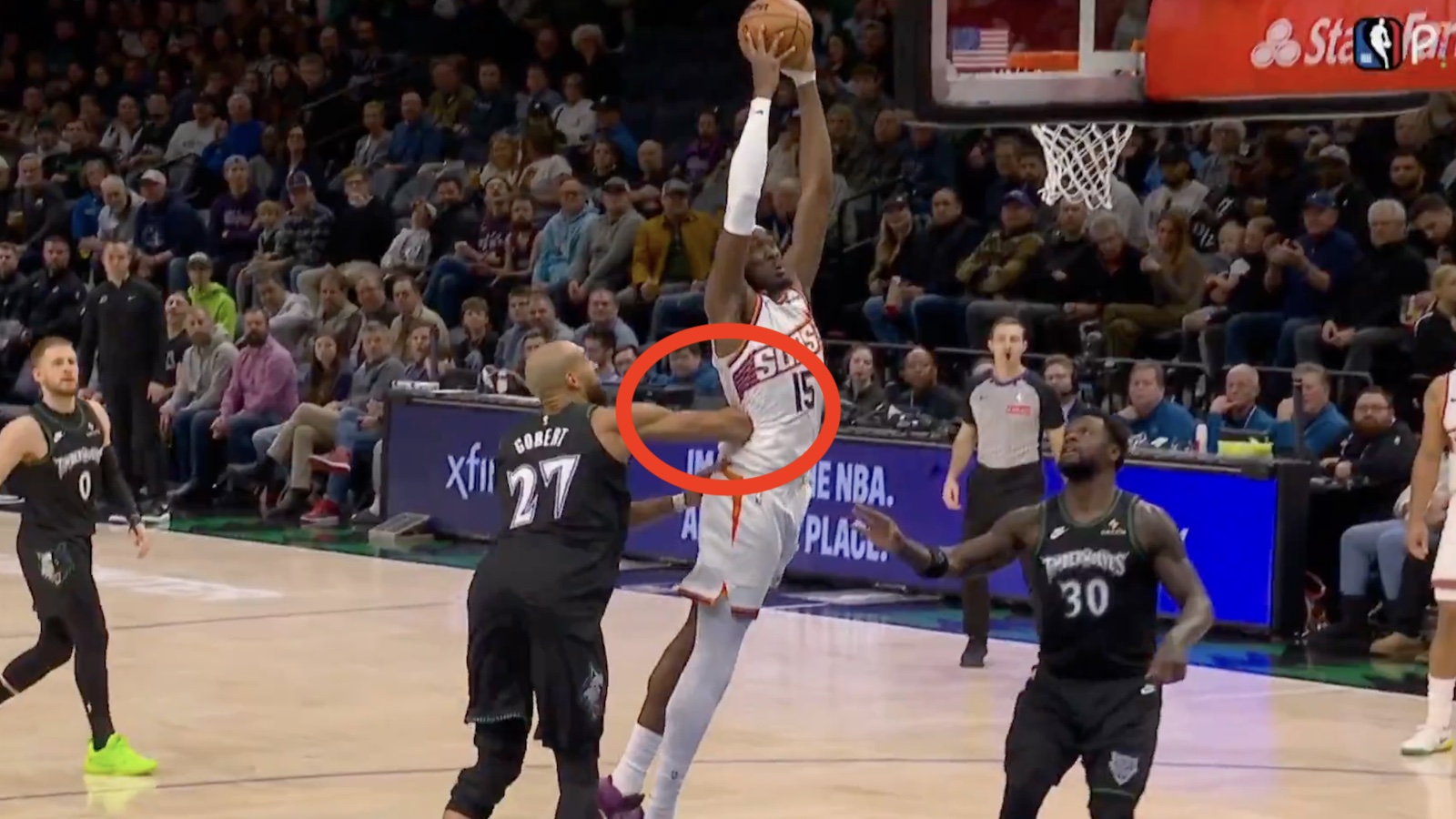 Timberwolves star Rudy Gobert delivering an elbow to Suns center Mark Williams