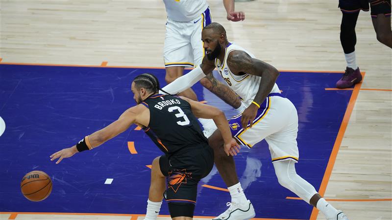 Dillon Brooks drives past LeBron James in a Phoenix Suns loss to the Los Angeles Lakers...