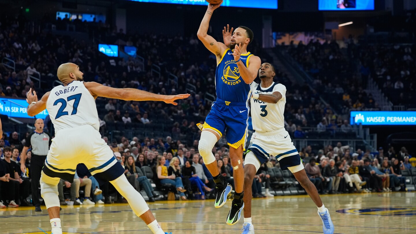 Curry scores 39 in return but Timberwolves top Warriors 127-120 without Edwards