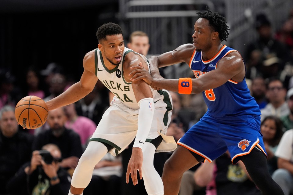 OG Anunoby #8 of the New York Knicks defends Giannis Antetokounmpo #34 of the Milwaukee Bucks