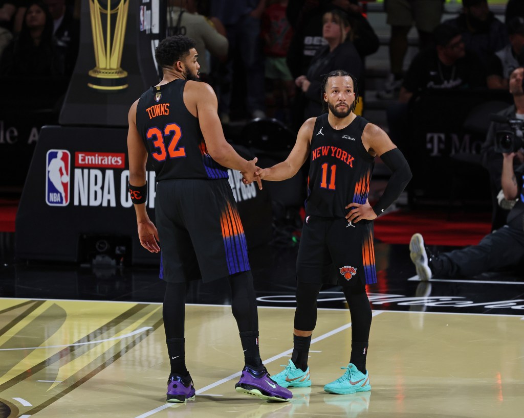 Karl-Anthony Towns and Jalen Brunson of the New York Knicks high-fiving.