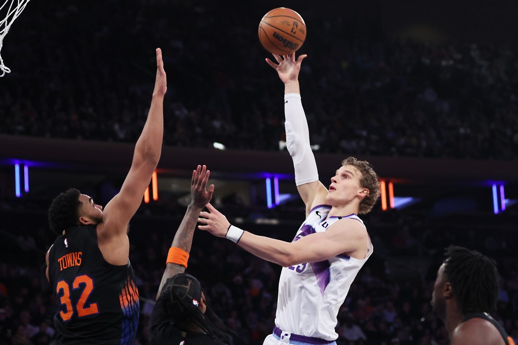 Utah Jazz forward Lauri Markkanen shoots the ball over New York Knicks center Karl-Anthony Towns.