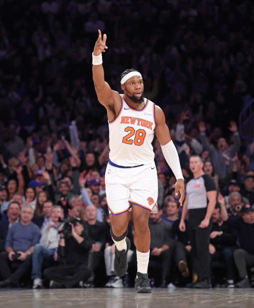 New York Knicks forward Guerschon Yabusele #28 reacts after he hits a three-point shot over LA Clippers forward John Collins #20 during the fourth quarter. The New York Knicks defeated the LA Clippers 123-111.