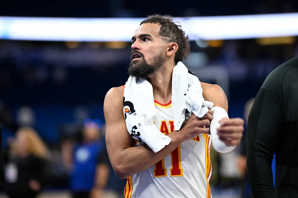 Atlanta Hawks guard Trae Young leaves the court after an NBA basketball game against the Orlando Magic, Friday, Oct. 24, 2025, in Orlando, Fla. (AP Photo/Phelan M. Ebenhack)