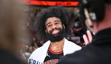 Chicago Bulls guard Coby White smiles during a postgame interview after a Play-In Tournament game against the Atlanta Hawks.
