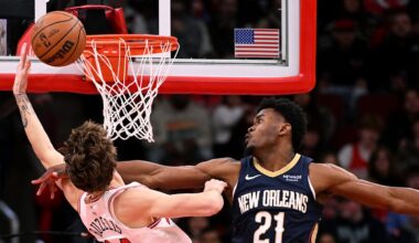 New Orleans Pelicans center Yves Missi reaches out to block a dunk attempt by Chicago Bulls forward Matas Buzelis.