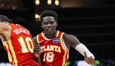 Atlanta Hawks forward Zaccharie Risacher and forward Mouhamed Gueye react after a play against the Los Angeles Lakers during the second half at State Farm Arena
