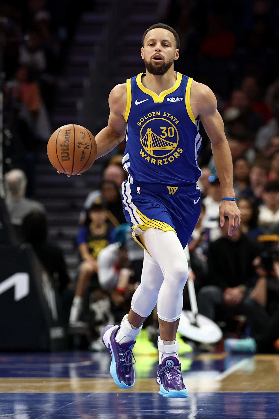 Stephen Curry of the Golden State Warriors brings the ball up court during the first half of the game on Dec. 31, 2025, against the Charlotte Hornets at Spectrum Center. Curry scored 26 points in a 132-125 win.
