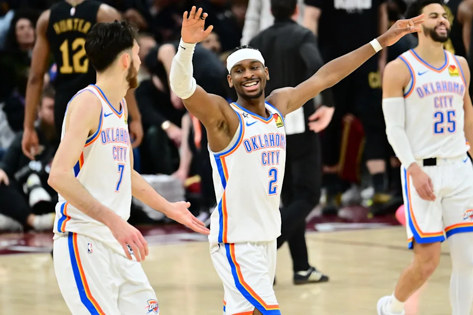Jan 19, 2026; Cleveland, Ohio, USA; Oklahoma City Thunder guard Luguentz Dort (5) and center Chet Holmgren (7) celebrate after a three point basket during the second half against the Cleveland Cavaliers at Rocket Arena. Mandatory Credit: Ken Blaze-Imagn Images