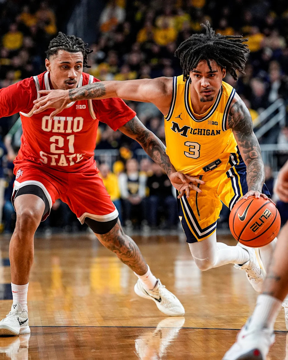 Michigan guard Elliot Cadeau (3) dribbles against Ohio State forward Devin Royal (21) during the first half at Crisler Center in Ann Arbor on Friday, Jan. 23, 2026.