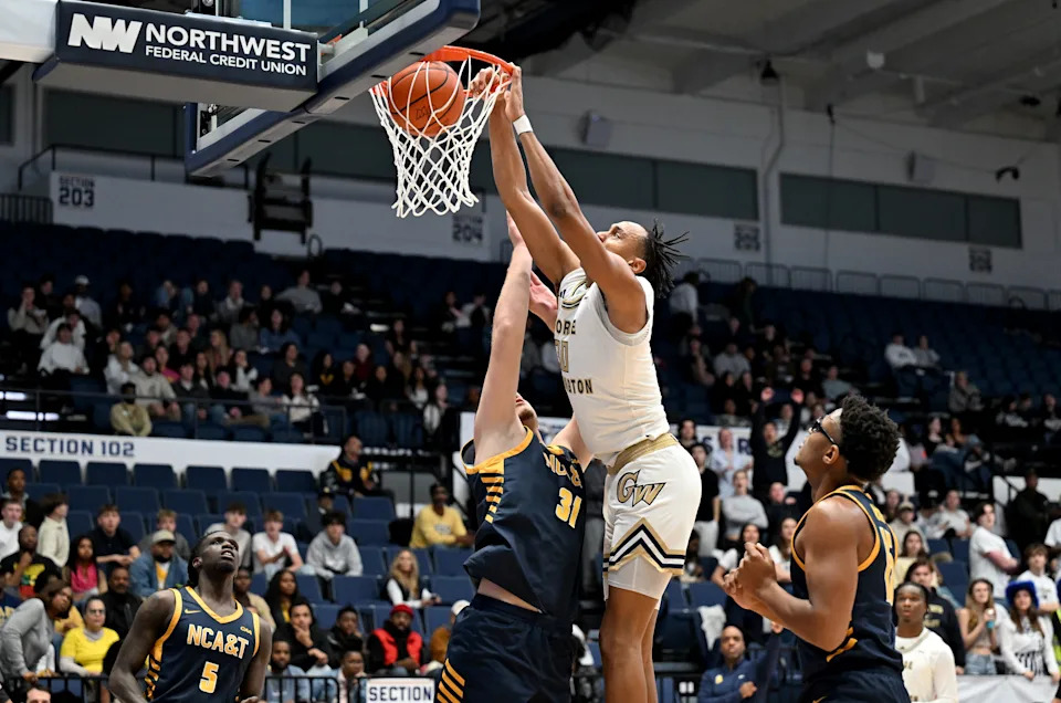 WASHINGTON, DC – NOVEMBER 12: Rafael Castro #30 of the George Washington Revolutionaries dunks the ball against the North Carolina A&T Aggies at Charles E. Smith Athletic Center on November 12, 2024 in Washington, DC. (Photo by G Fiume/Getty Images)