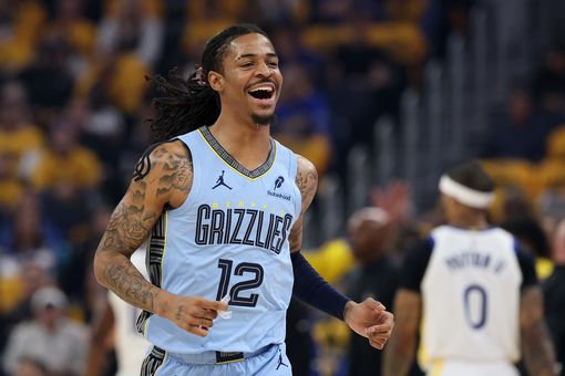 SAN FRANCISCO, CALIFORNIA - APRIL 15: Ja Morant #12 of the Memphis Grizzlies smiles as he runs back to the bench during a time out of their game against the Golden State Warriors in the first half of the NBA play-in tournament game at Chase Center on April 15, 2025 in San Francisco, California. 