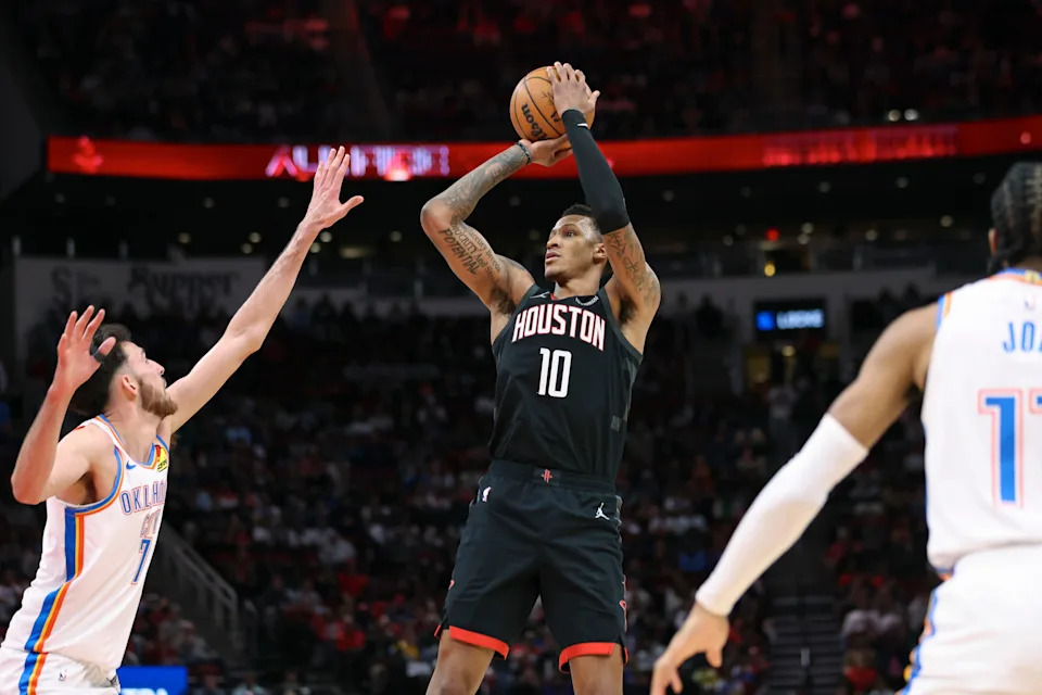 Jan 15, 2026; Houston, Texas, USA; Houston Rockets forward Jabari Smith Jr. (10) shoots the ball as Oklahoma City Thunder center Chet Holmgren (7) defends during the second quarter at Toyota Center. Mandatory Credit: Troy Taormina-Imagn Images
