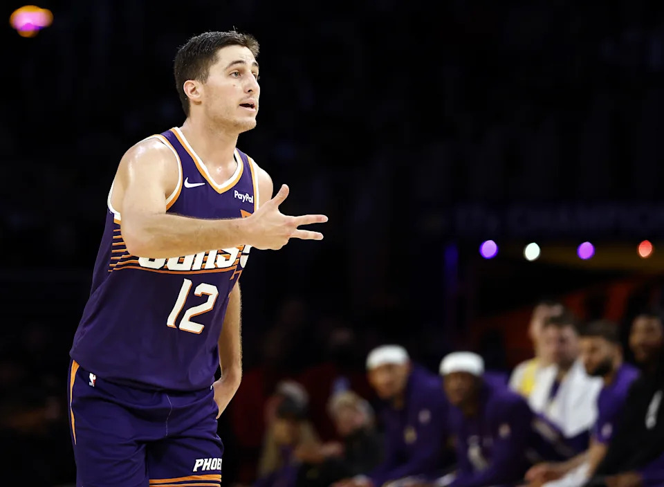 LOS ANGELES, CALIFORNIA – DECEMBER 01: Collin Gillespie #12 of the Phoenix Suns reacts after scoring a three-point shot against the Los Angeles Lakers in the second half at Crypto.com Arena on December 01, 2025 in Los Angeles, California. NOTE TO USER: User expressly acknowledges and agrees that, by downloading and or using this photograph, User is consenting to the terms and conditions of the Getty Images License Agreement. (Photo by Ronald Martinez/Getty Images)