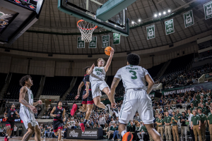 Ohio Men's Basketball forward Aidan Hadaway finishing a layup against Northern Illinois.