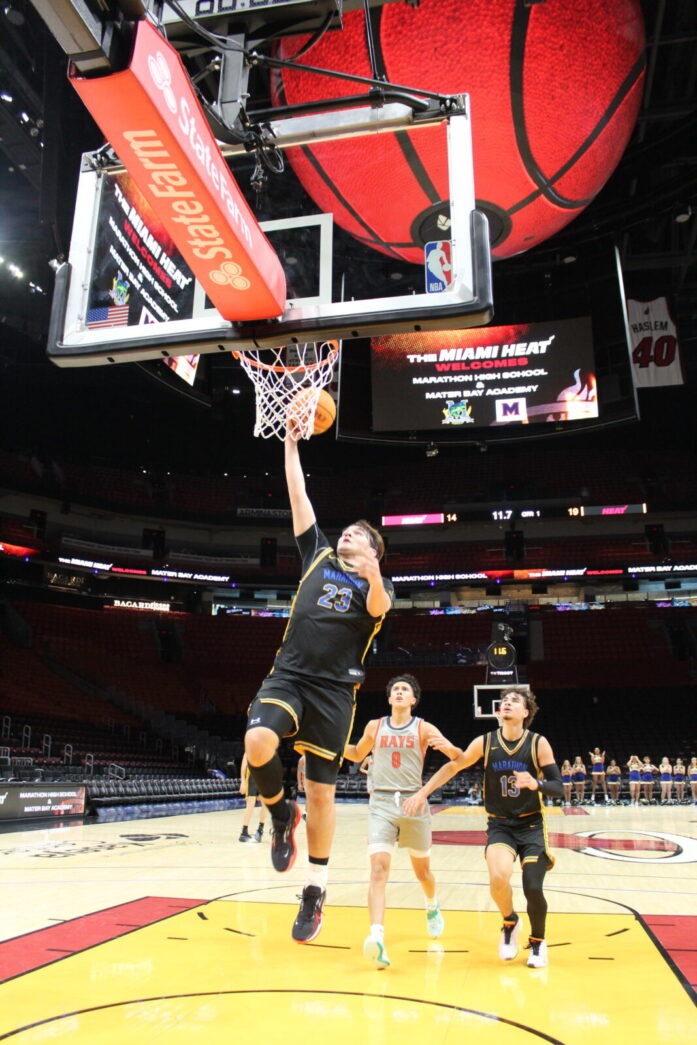 a man dunking a basketball into the hoop