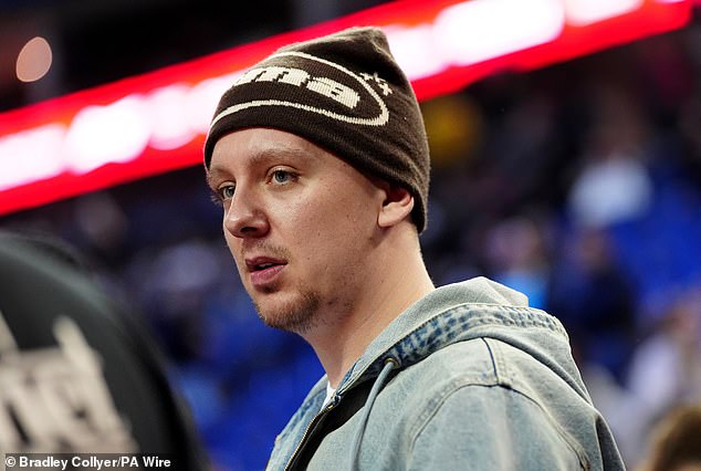 Rapper Aitch sported a black hat as he arrived at the showpiece event in the English capital