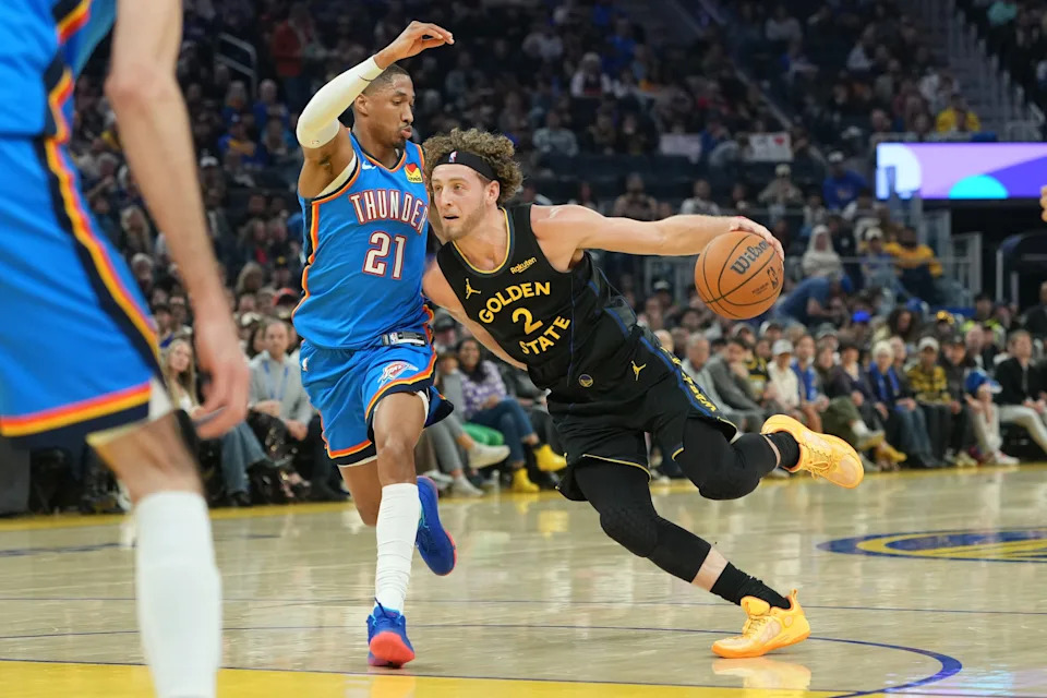 Jan 2, 2026; San Francisco, California, USA; Golden State Warriors guard Brandin Podziemski (2) dribbles against Oklahoma City Thunder guard Aaron Wiggins (21) during the second quarter at Chase Center. Mandatory Credit: Darren Yamashita-Imagn Images