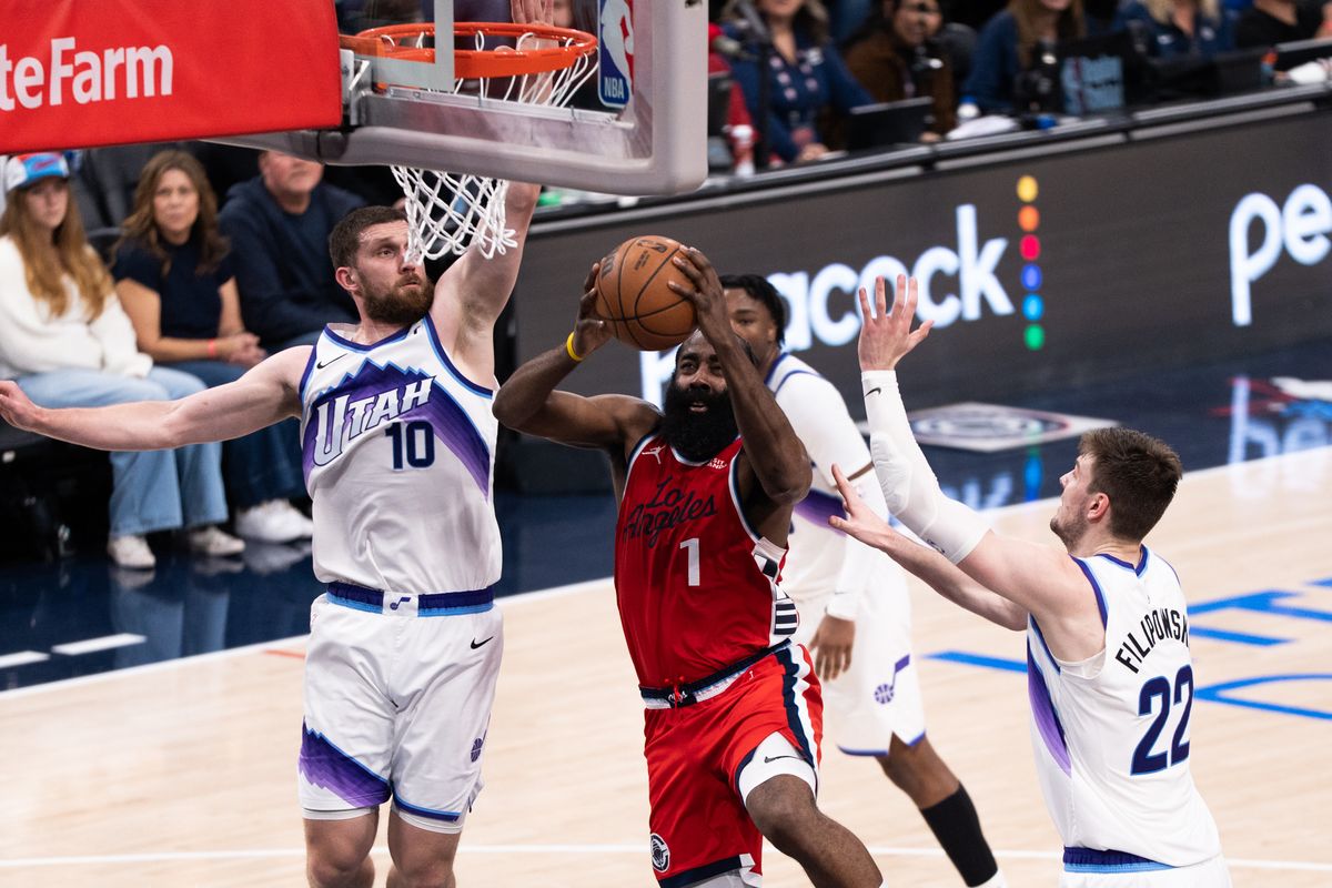 Los Angeles Clippers Guard James Harden (1) attacks the rim of three defenders and scores during an NBA basketball game against the Utah Jazz, Thursday January 1st, 2026 in Inglewood, California. Los Angeles Clippers Guard James Harden (1) attacks the rim of three defenders and scores during an NBA basketball game against the Utah Jazz, Thursday January 1st, 2026 in Inglewood, California.