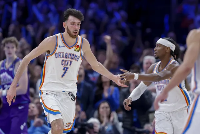Jan 7, 2026; Oklahoma City, Oklahoma, USA; Oklahoma City Thunder center/forward Chet Holmgren (7) and Oklahoma City Thunder guard Shai Gilgeous-Alexander (2) celebrate after a basket during overtime against the Utah Jazz at Paycom Center.