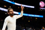 Atlanta Hawks guard Trae Young reacts during pregame warmups before the start of an NBA...