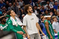 Dallas Mavericks forward Dwight Powell (7), left, and Dallas Mavericks center Dereck Lively...