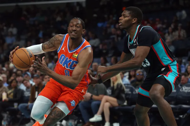 Jan 9, 2026; Memphis, Tennessee, USA; Oklahoma City Thunder guard Jalen Williams (8) drives to the basket as Memphis Grizzlies forward Cedric Coward (23) defends during the first quarter at FedExForum. Mandatory Credit: Petre Thomas-Imagn Images
