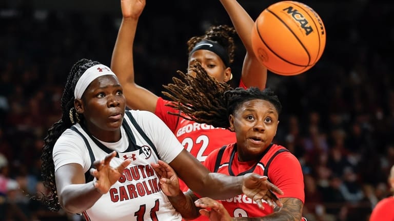 South Carolina center Madina Okot (11) battles Georgia guard Trinity...