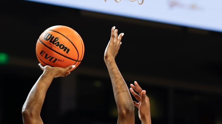 South Carolina forward Joyce Edwards (8) goes up to shoot...