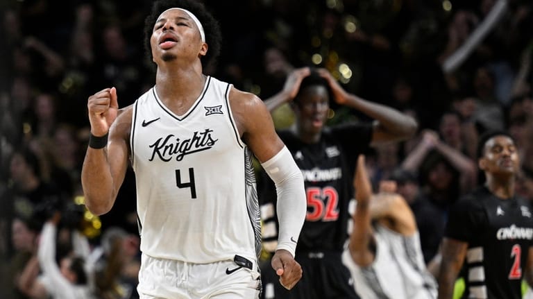Central Florida forward Jamichael Stillwell (4) celebrates after getting the...