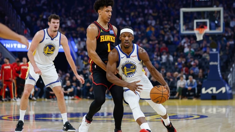 Golden State Warriors Jimmy Butler III (10) dribbles the ball...