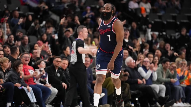 Los Angeles Clippers guard James Harden (1) celebrates his three-point...