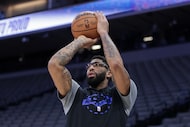 Dallas Mavericks forward Anthony Davis warms up before an NBA basketball game against the...