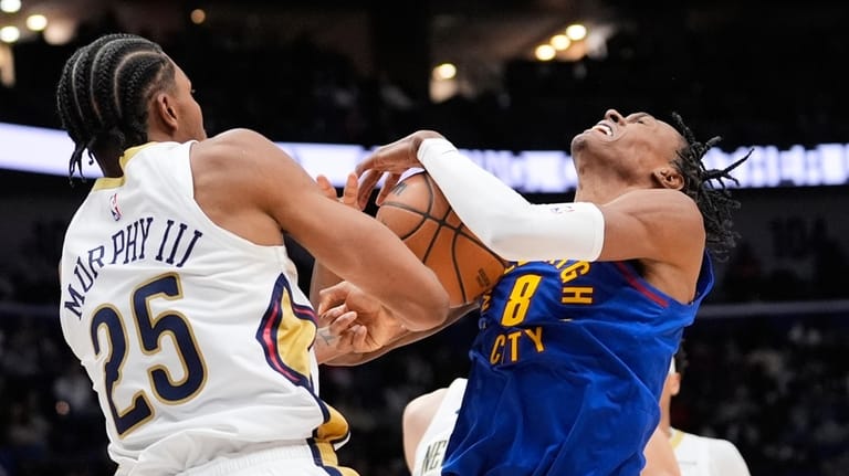 Denver Nuggets guard Peyton Watson (8) battles for the ball...