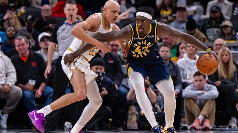 Indiana Pacers forward Pascal Siakam, right, works the ball inside...