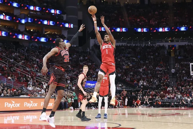 Jan 13, 2026; Houston, Texas, USA; Houston Rockets guard Amen Thompson (1) shoots the ball as Chicago Bulls forward Jalen Smith (25) defends during the second half at Toyota Center.