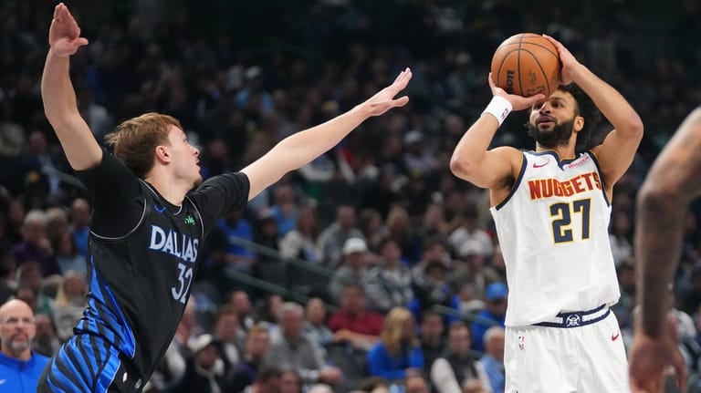 Denver Nuggets guard Jamal Murray (27) shoots a basket against...
