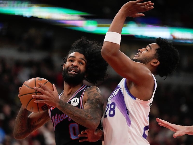 Utah Jazz forward Brice Sensabaugh (28), right, guards Chicago Bulls guard Coby White (0) during the first half of an NBA basketball game Wednesday, Jan. 14, 2026, in Chicago.