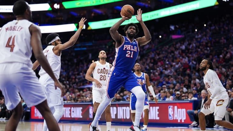 Philadelphia 76ers' Joel Embiid (21) goes up for a shot...